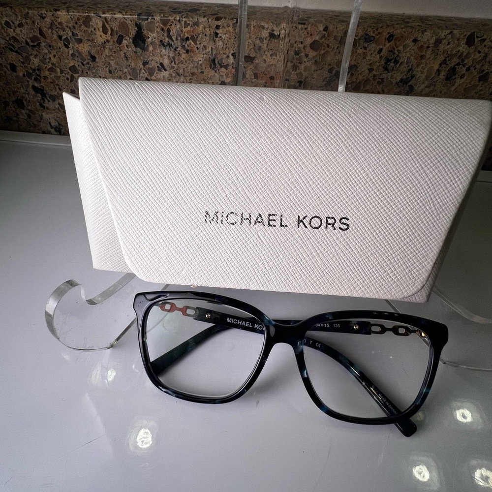 Michael Kors women’s preowned, marbled blue eyeglasses with a white case